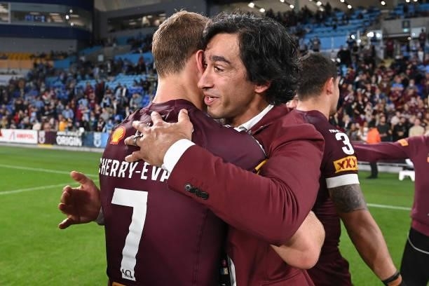Daly Cherry-Evans of the Maroons and Maroons assistant coach Johnathan Thurston celebrate winning game three of the 2021 State of Origin Series...