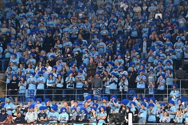 Blues fans watch game three of the 2021 State of Origin Series between the New South Wales Blues and the Queensland Maroons at Cbus Super Stadium on...