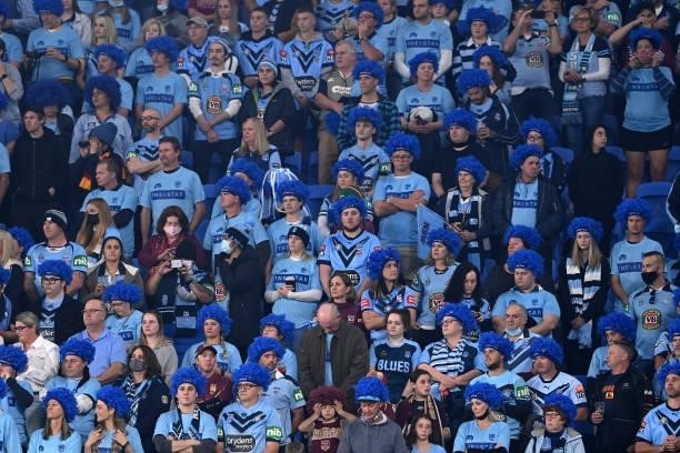 Blues fans watch game three of the 2021 State of Origin Series between the New South Wales Blues and the Queensland Maroons at Cbus Super Stadium on...