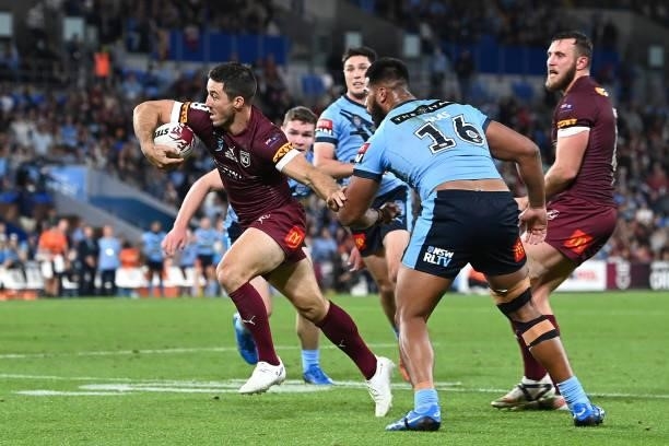 Ben Hunt of the Maroons makes a break to score a try during game three of the 2021 State of Origin Series between the New South Wales Blues and the...