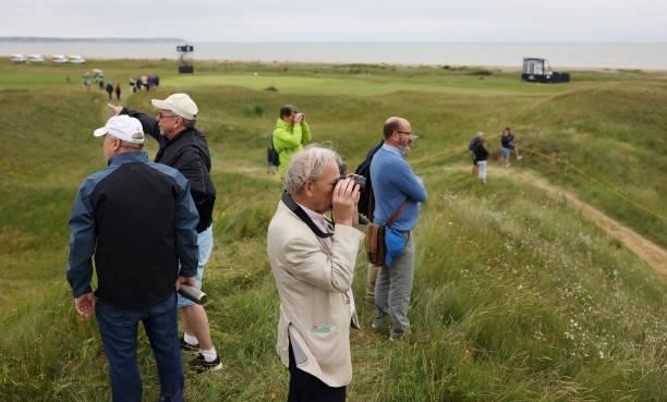 Spectators look on during a practice round for The 149th Open at Royal St George’s Golf Club on July 14, 2021 in Sandwich, England.