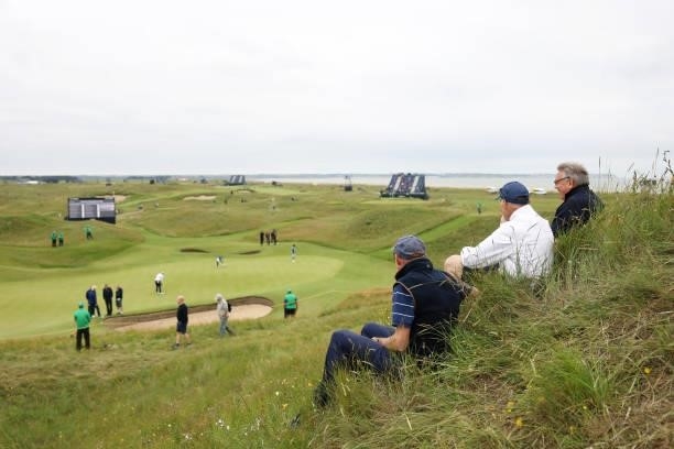 Spectators look on during a practice round for The 149th Open at Royal St George’s Golf Club on July 14, 2021 in Sandwich, England.