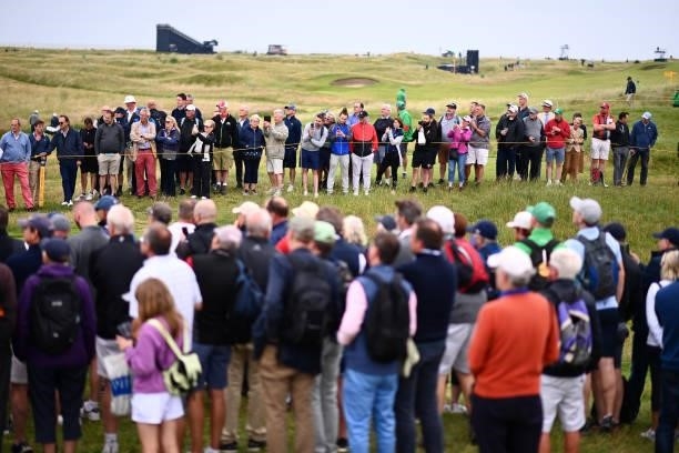 Spectators gather on the 17th hole during a practice round for The 149th Open at Royal St George’s Golf Club on July 14, 2021 in Sandwich, England.