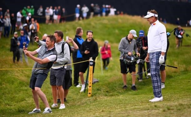 Ian Poulter of England poses for a photograph with fans during a practice round for The 149th Open at Royal St George’s Golf Club on July 14, 2021 in...