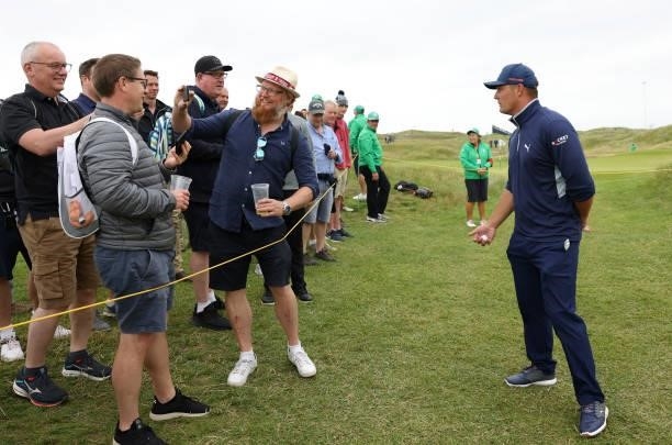 Bryson Dechambeau of The United States interacts with fans during a practice round for The 149th Open at Royal St George’s Golf Club on July 14, 2021...