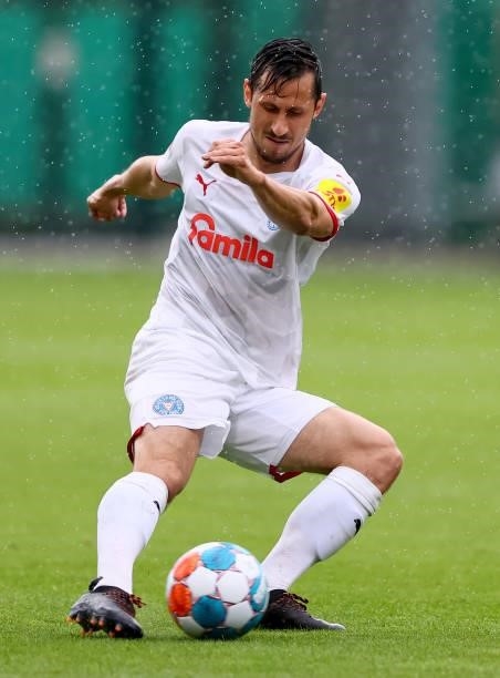Steven Skrzybski of Holstein Kiel runs with the ball during a pre-season friendly match between VfL Wolfsburg and Holstein Kiel at AOK-Stadion on...