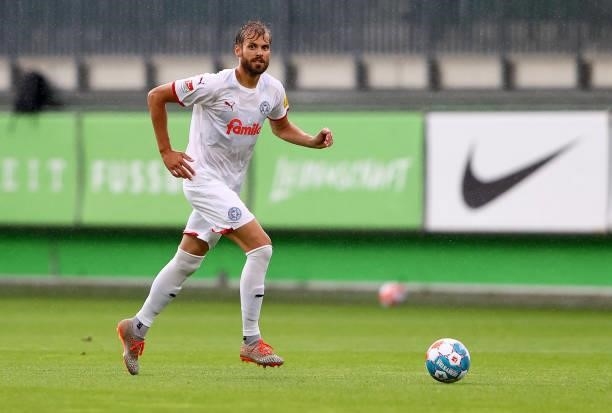Stefan Thesker of Holstein Kiel runs with the ball during a pre-season friendly match between VfL Wolfsburg and Holstein Kiel at AOK-Stadion on July...