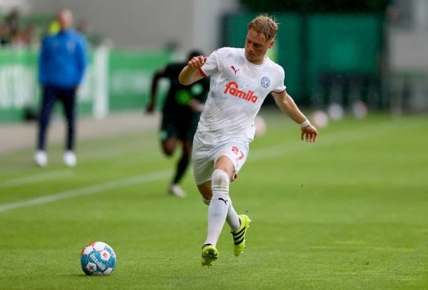 Finn Porath of Holstein Kiel runs with the ball during a pre-season friendly match between VfL Wolfsburg and Holstein Kiel at AOK-Stadion on July 14,...