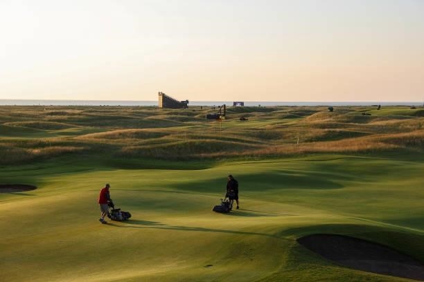 General view across the course as greenkeepers tend to the greens prior to Day One of The 149th Open at Royal St George’s Golf Club on July 15, 2021...