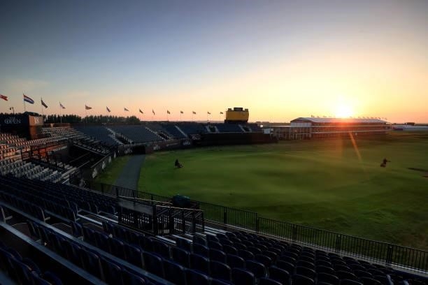 Greenkeepers work on the eighteenth hole as the sun rises ahead of Day One of The 149th Open at Royal St George’s Golf Club on July 15, 2021 in...