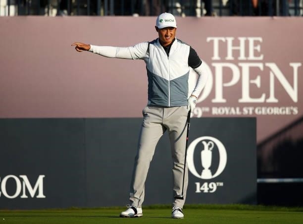 Haotong Li of China reacts after playing his shot from the first tee during Day One of The 149th Open at Royal St George’s Golf Club on July 15, 2021...