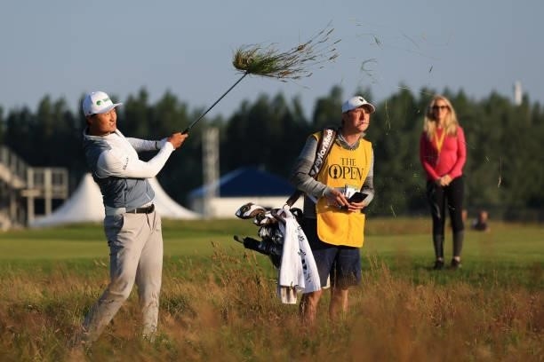 Haotong Li of China hits his second shot on the first hole during Day One of The 149th Open at Royal St George’s Golf Club on July 15, 2021 in...