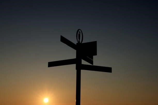 Signpost is pictured as the sun rises during Day One of The 149th Open at Royal St George’s Golf Club on July 15, 2021 in Sandwich, England.