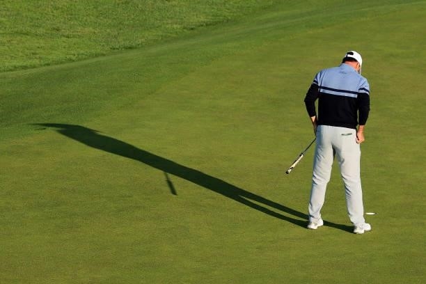 Richard Bland of England putts on the 1st green during Day One of The 149th Open at Royal St George’s Golf Club on July 15, 2021 in Sandwich, England.