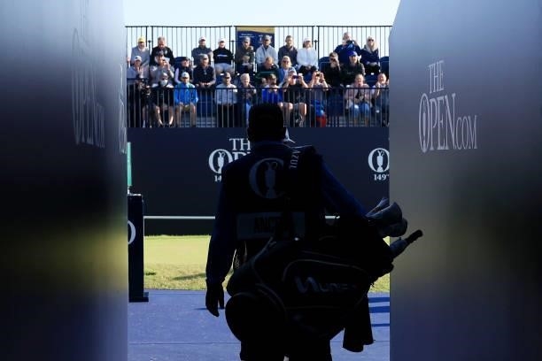 Caddie walks to the 1st tee during Day One of The 149th Open at Royal St George’s Golf Club on July 15, 2021 in Sandwich, England.