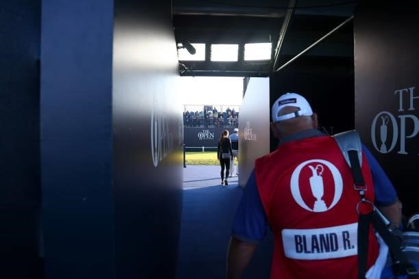 Caddie walks to the 1st tee during Day One of The 149th Open at Royal St George’s Golf Club on July 15, 2021 in Sandwich, England.