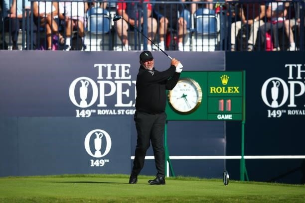 Darren Clarke of Northern Ireland plays his shot from the first tee during Day One of The 149th Open at Royal St George’s Golf Club on July 15, 2021...