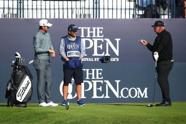 Darren Clarke of Northern Ireland interacts with Bernd Wiesberger of Austria during Day One of The 149th Open at Royal St George’s Golf Club on July...