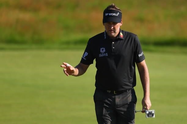 Ian Poulter of England acknowledges the crowd on the 3rd green during Day One of The 149th Open at Royal St George’s Golf Club on July 15, 2021 in...