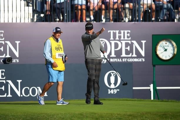 Ian Poulter of England reacts after playing his shot from the first tee during Day One of The 149th Open at Royal St George’s Golf Club on July 15,...