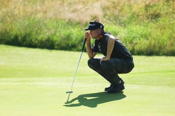 Ian Poulter of England lines up a shot on the green of the sixth hole during Day One of The 149th Open at Royal St George’s Golf Club on July 15,...