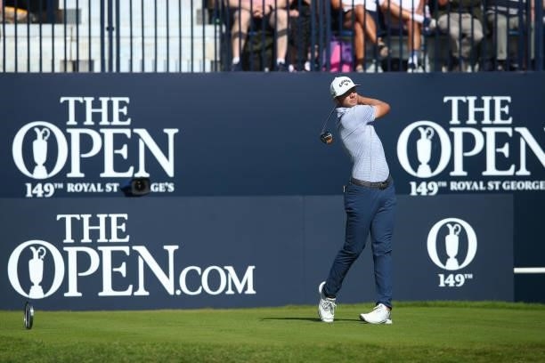 Sam Burns of the United States plays his shot from the first tee during Day One of The 149th Open at Royal St George’s Golf Club on July 15, 2021 in...