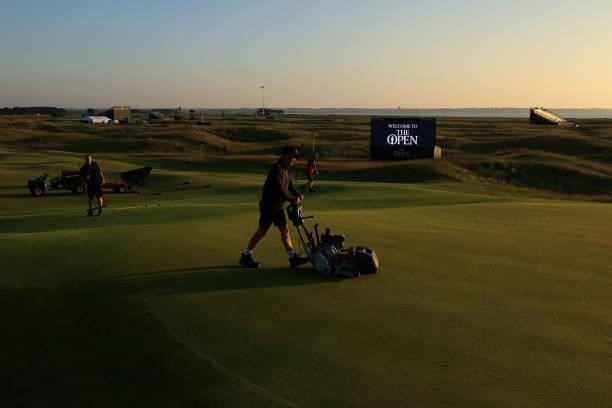 Greenkeepers mow the 10th green ahead of Day One of The 149th Open at Royal St George’s Golf Club on July 15, 2021 in Sandwich, England.