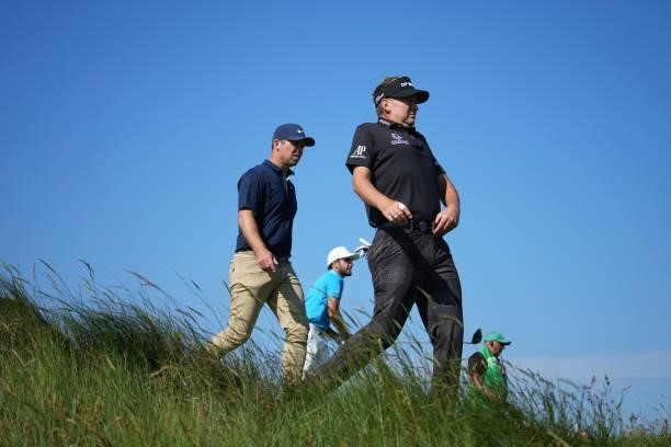 Paul Casey of England, Abraham Ancer of Mexico and Ian Poulter of England make their way from the seventh tee during Day One of The 149th Open at...