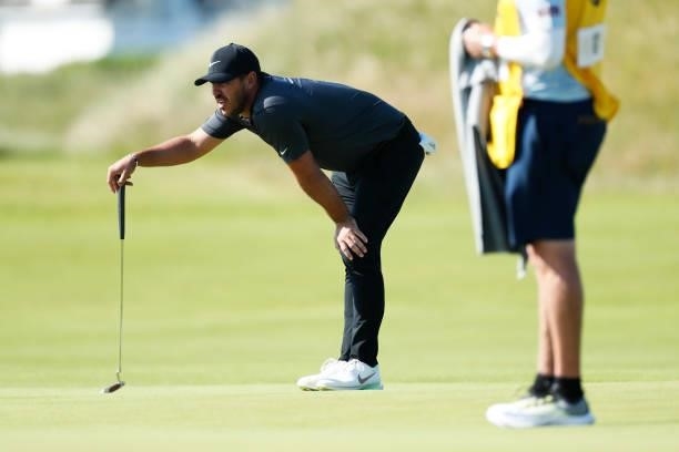 Brooks Koepka of the United States lines up a shot on the green of the fifth hole during Day One of The 149th Open at Royal St George’s Golf Club on...