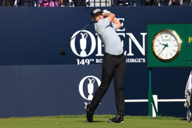 Mackenzie Hughes of Canada plays his shot from the first tee during Day One of The 149th Open at Royal St George’s Golf Club on July 15, 2021 in...
