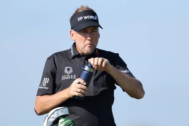 Ian Poulter of England drinks from a reusable water bottle during Day One of The 149th Open at Royal St George’s Golf Club on July 15, 2021 in...