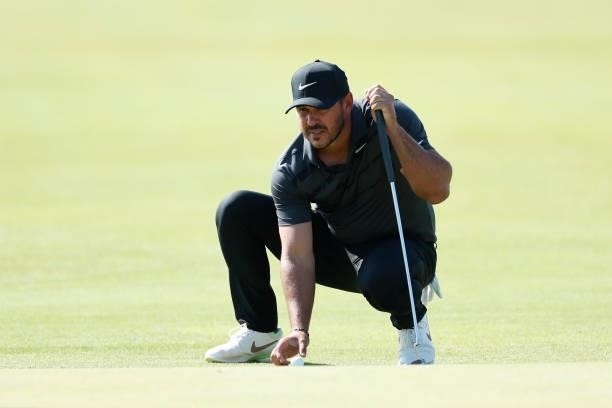 Brooks Koepka of the United States lines up a shot on the green of the seventh hole during Day One of The 149th Open at Royal St George’s Golf Club...