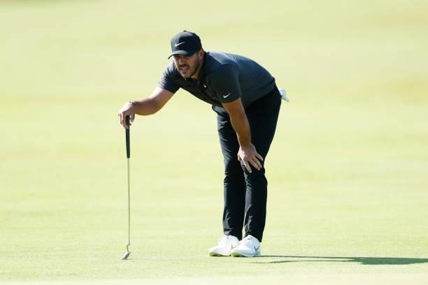 Brooks Koepka of the United States lines up a shot on the green of the seventh hole during Day One of The 149th Open at Royal St George’s Golf Club...