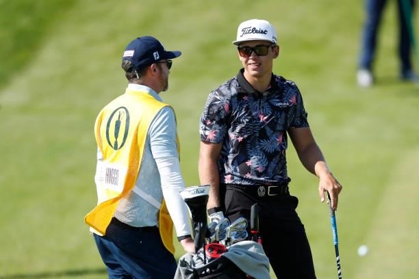 Garrick Higgo of South Africa speaks with his caddie before he plays a shot on the seventh hole during Day One of The 149th Open at Royal St George’s...