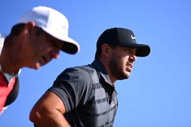 Brooks Koepka of The United States and caddie look on during Day One of The 149th Open at Royal St George’s Golf Club on July 15, 2021 in Sandwich,...