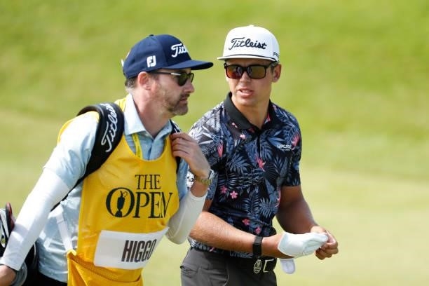 Garrick Higgo of South Africa interacts with his caddie on the ninth hole during Day One of The 149th Open at Royal St George’s Golf Club on July 15,...
