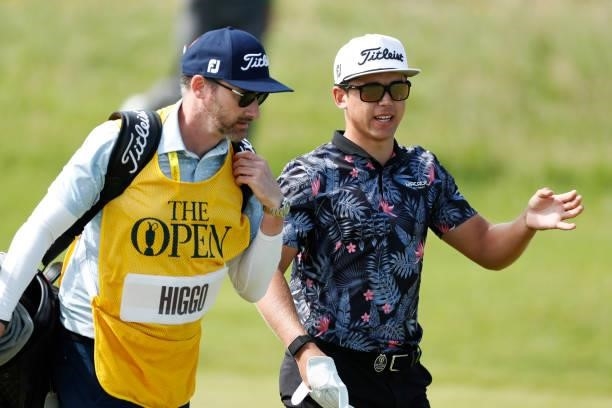 Garrick Higgo of South Africa interacts with his caddie on the ninth hole during Day One of The 149th Open at Royal St George’s Golf Club on July 15,...