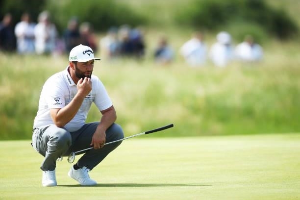 Jon Rahm of Spain lines up a shot on the green of the second hole during Day One of The 149th Open at Royal St George’s Golf Club on July 15, 2021 in...