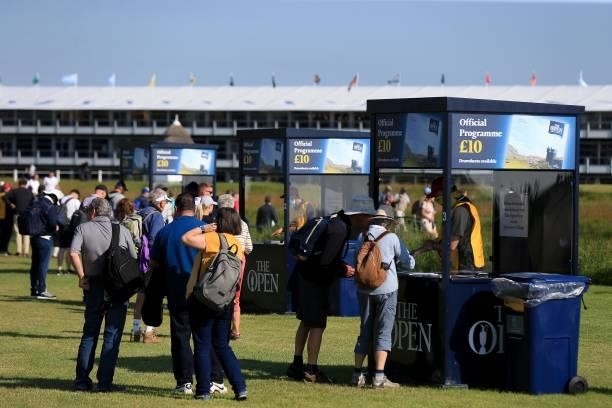 Spectators buy official programmes during Day One of The 149th Open at Royal St George’s Golf Club on July 15, 2021 in Sandwich, England.