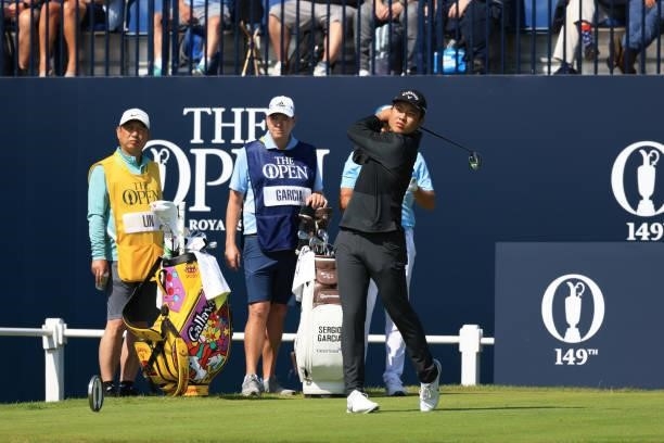 Amateur Yuxin Lin of China plays his shot from the first tee during Day One of The 149th Open at Royal St George’s Golf Club on July 15, 2021 in...