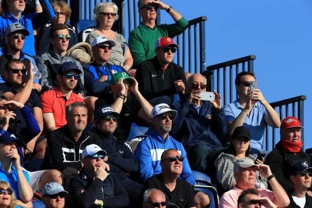 Spectators watch play on the first tee during Day One of The 149th Open at Royal St George’s Golf Club on July 15, 2021 in Sandwich, England.