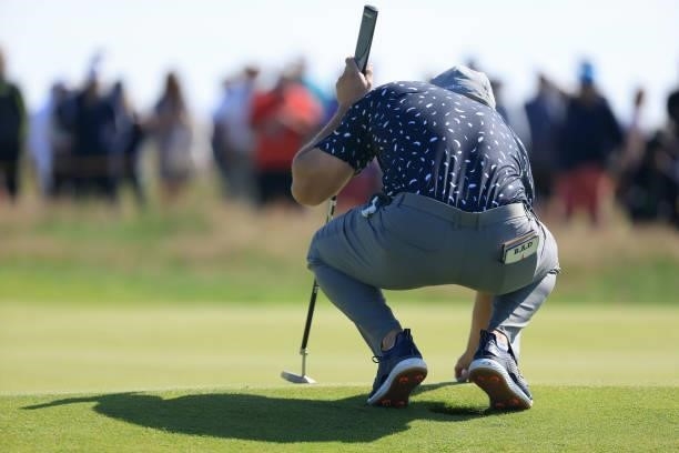 Bryson Dechambeau of The United States lines up a putt during Day One of The 149th Open at Royal St George’s Golf Club on July 15, 2021 in Sandwich,...