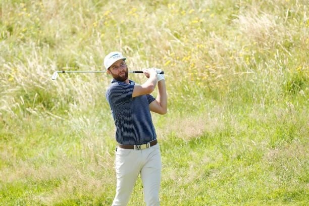 Chris Kirk of the United States plays a shot on the ninth hole during Day One of The 149th Open at Royal St George’s Golf Club on July 15, 2021 in...