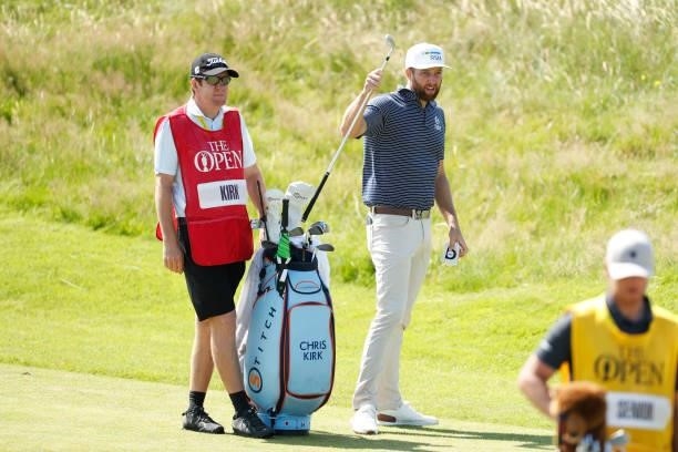 Chris Kirk of the United States picks a club on the ninth hole during Day One of The 149th Open at Royal St George’s Golf Club on July 15, 2021 in...