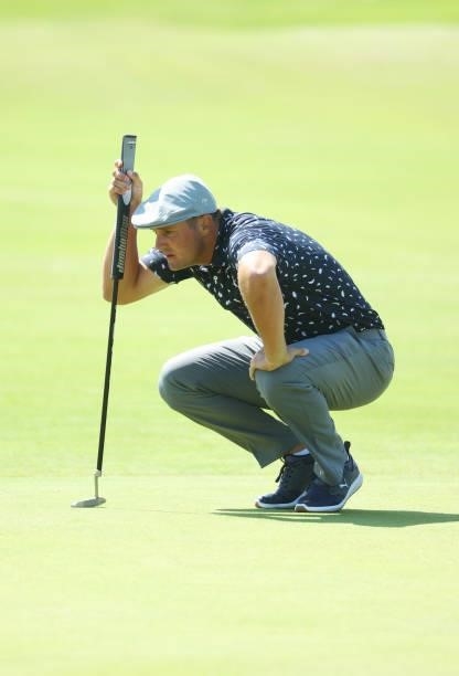 Bryson DeChambeau of the United States lines up a shot on the green of the seventh hole during Day One of The 149th Open at Royal St George’s Golf...