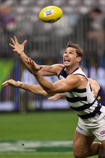 Tom Hawkins of the Cats contests for a mark during the round 18 AFL match between the Fremantle Dockers and Geelong Cats at Optus Stadium on July 15,...