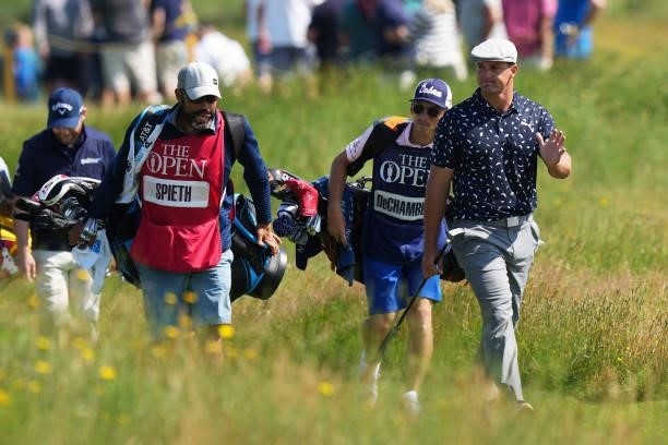 Bryson DeChambeau of the United States acknowledges the fans as he makes his way along the sixth hole during Day One of The 149th Open at Royal St...