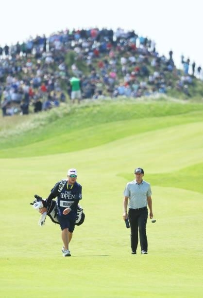 Mackenzie Hughes of Canada makes his way down the seventh hole during Day One of The 149th Open at Royal St George’s Golf Club on July 15, 2021 in...