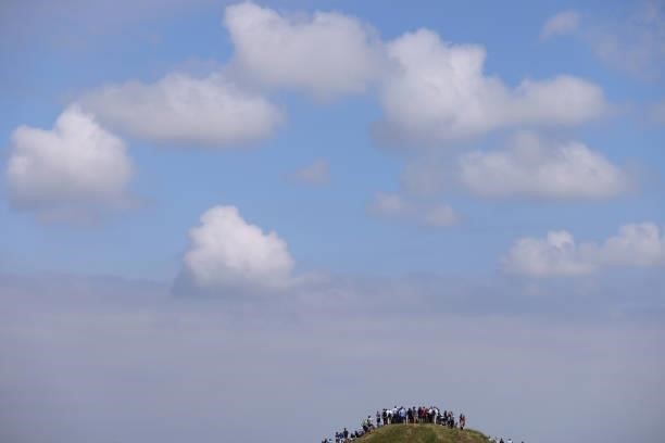 Spectators look on from a hill during Day One of The 149th Open at Royal St George’s Golf Club on July 15, 2021 in Sandwich, England.