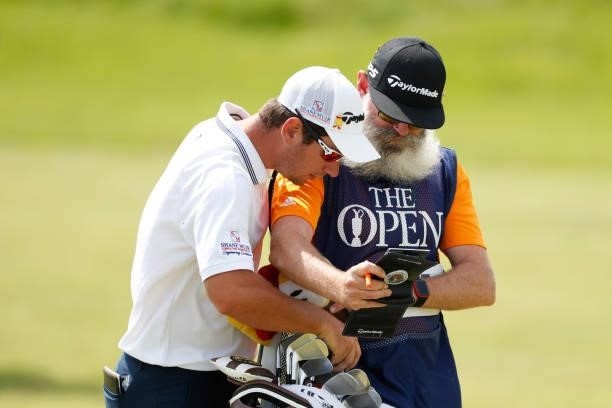 Lucas Herbert of Australia picks a club on the ninth hole during Day One of The 149th Open at Royal St George’s Golf Club on July 15, 2021 in...